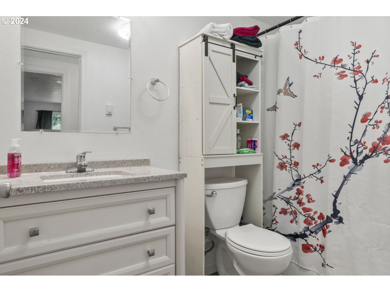 1147 33rd Street Springfield, OR 97478 - Photo 32 of 44 a bathroom with a granite countertop toilet sink and mirror