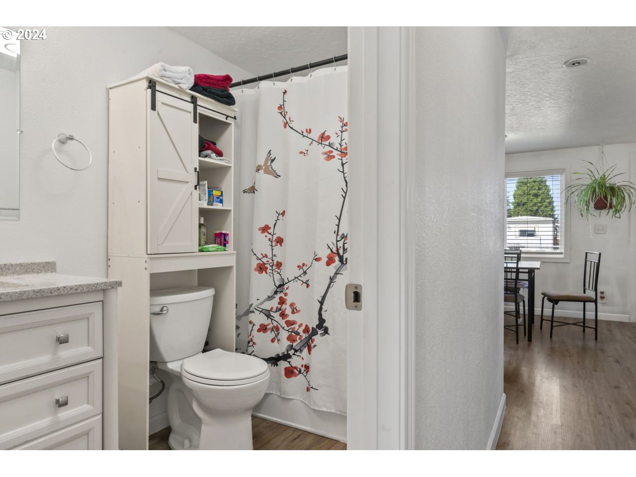 1147 33rd Street Springfield, OR 97478 - Photo 33 of 44 a bathroom with a toilet and a shower curtain