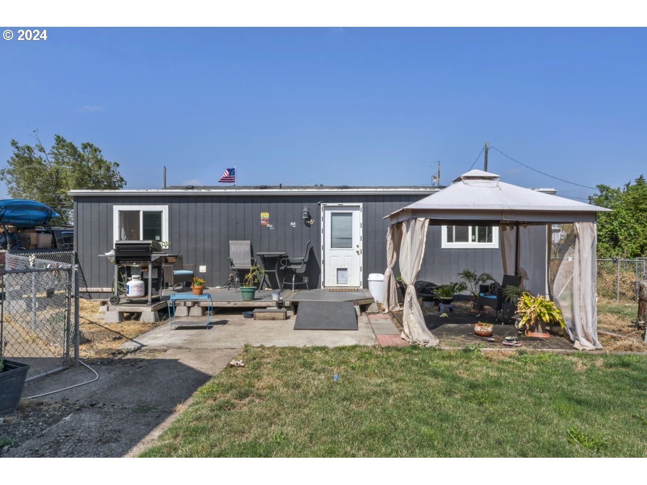 1147 33rd Street Springfield, OR 97478 - Photo 41 of 44 a view of the house with backyard porch and sitting area