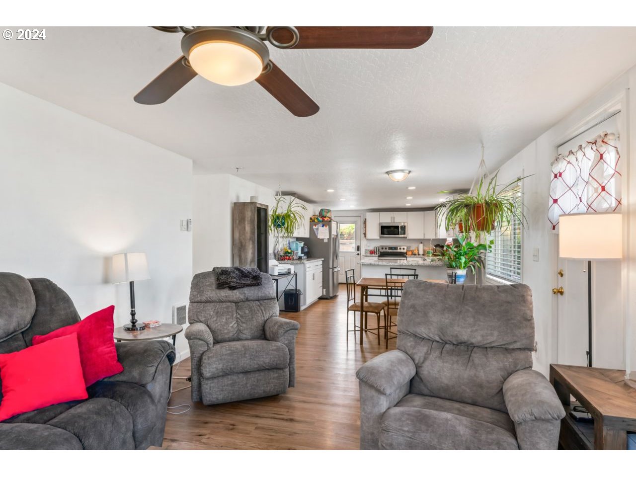 1147 33rd Street Springfield, OR 97478 - Photo 6 of 44 a living room with furniture and kitchen view