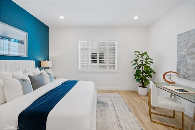 a bedroom with furniture and a window