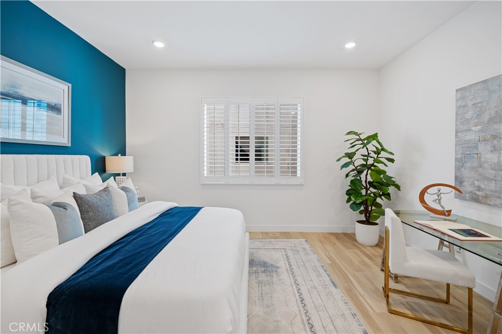 163 Baluster Irvine, CA 92618 - Photo 18 of 32 a bedroom with furniture and a window