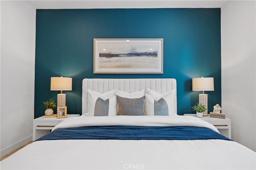 163 Baluster Irvine, CA 92618 - Photo 20 of 32 a bedroom with a bed and a painting on the wall