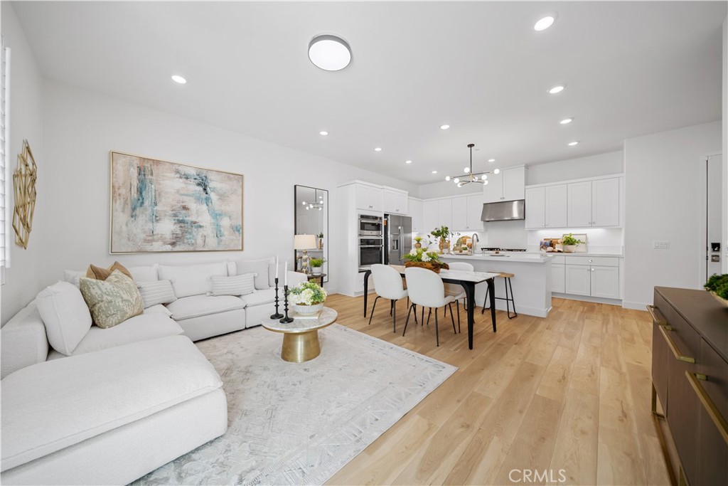 163 Baluster Irvine, CA 92618 - Photo 2 of 32 a living room with furniture and kitchen view