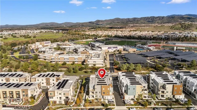 an aerial view of residential building and lake
