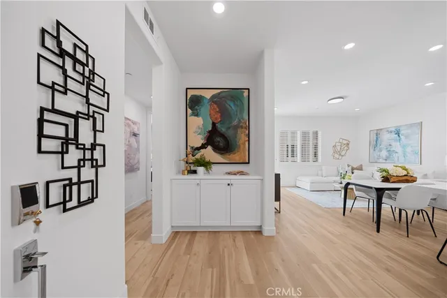 a view of a living room and dining room