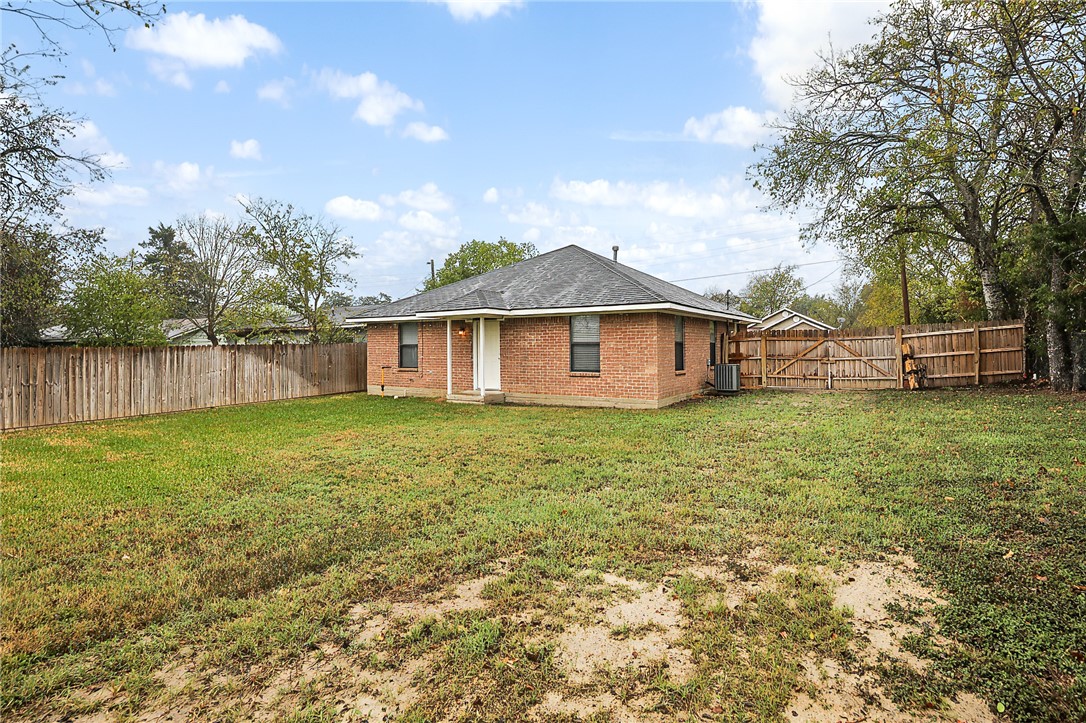 314 Moss Street Bryan, TX 77803 - Photo 17 of 18 a backyard of a house with table and chairs