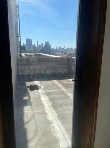 a view of balcony with yard