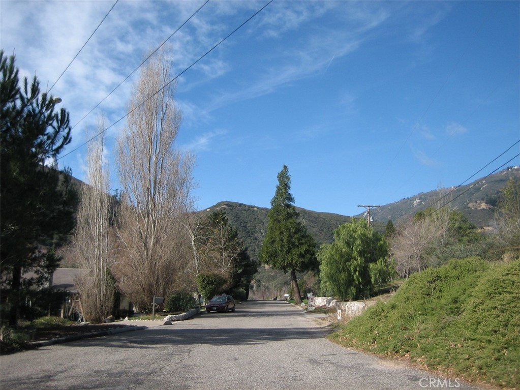 a view of a road with a building in the background