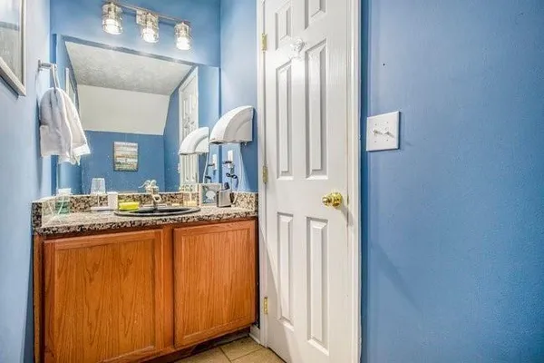 a kitchen with stainless steel appliances granite countertop a stove and a refrigerator