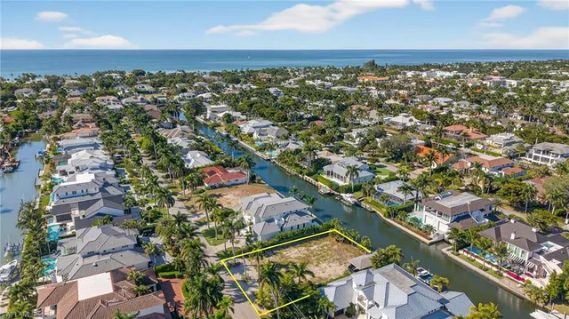 an aerial view of residential building and ocean