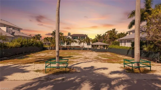 a view of a swimming pool with a bench