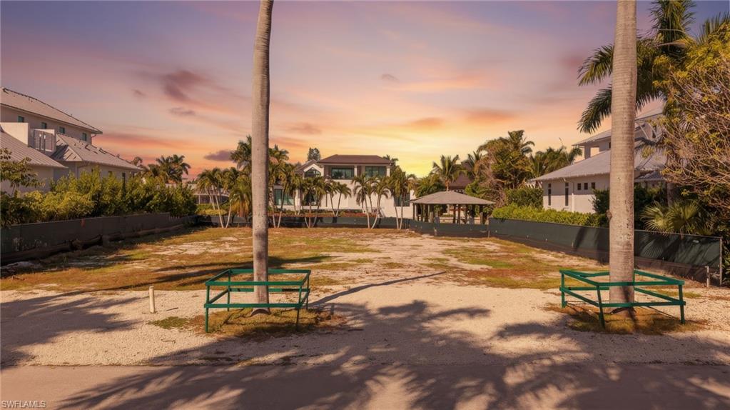 601 17th Avenue South Naples, FL 34102 - Photo 5 of 16 a view of a swimming pool with a bench