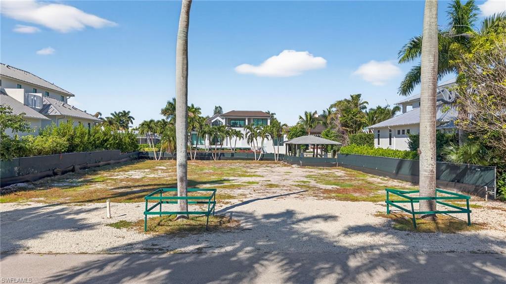 601 17th Avenue South Naples, FL 34102 - Photo 6 of 16 a view of a swimming pool with a patio