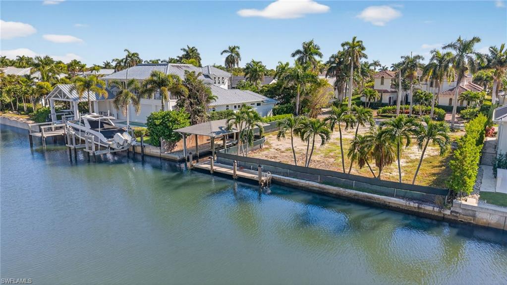 601 17th Avenue South Naples, FL 34102 - Photo 8 of 16 a view of swimming pool with a table and chairs