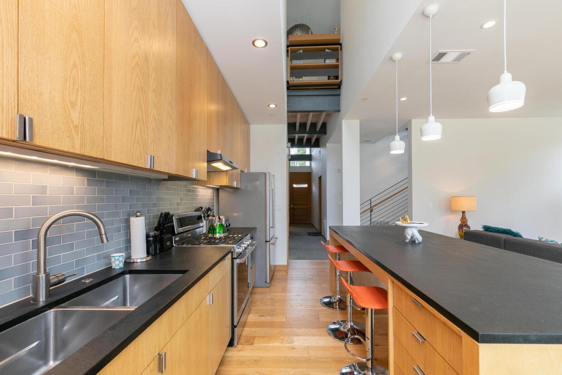 15004 Peak View Place Truckee, CA 96161 - Photo 12 of 21 a kitchen with stainless steel appliances a sink a stove and a wooden floor