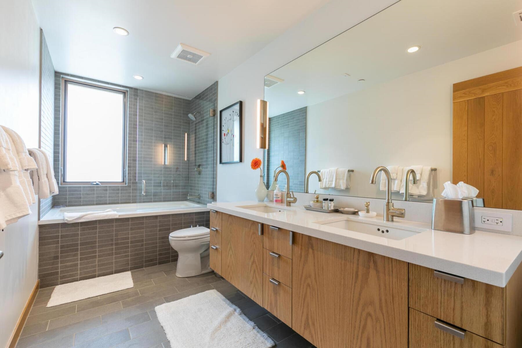 15004 Peak View Place Truckee, CA 96161 - Photo 17 of 21 a bathroom with a double vanity sink toilet mirror and bathtub