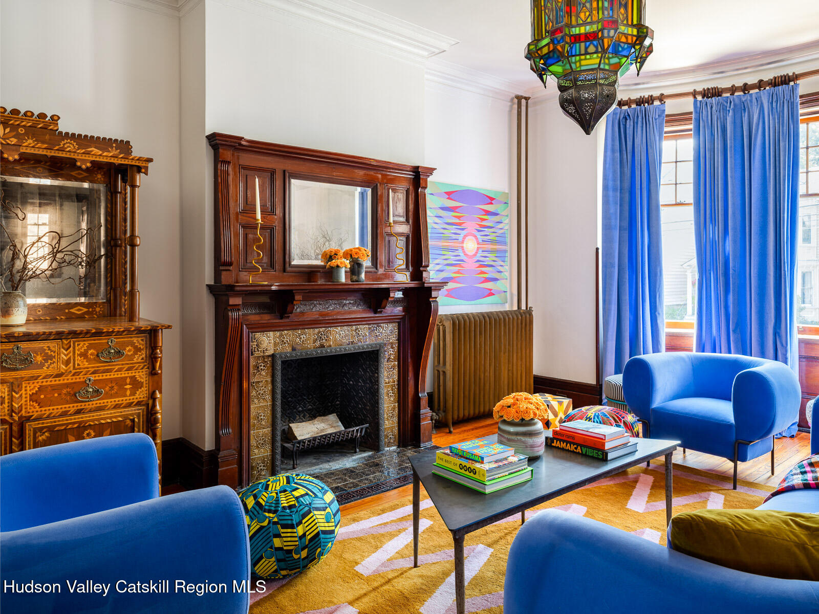 164 Grand Street Newburgh, NY 12550 - Photo 11 of 59 a living room with furniture and a fireplace