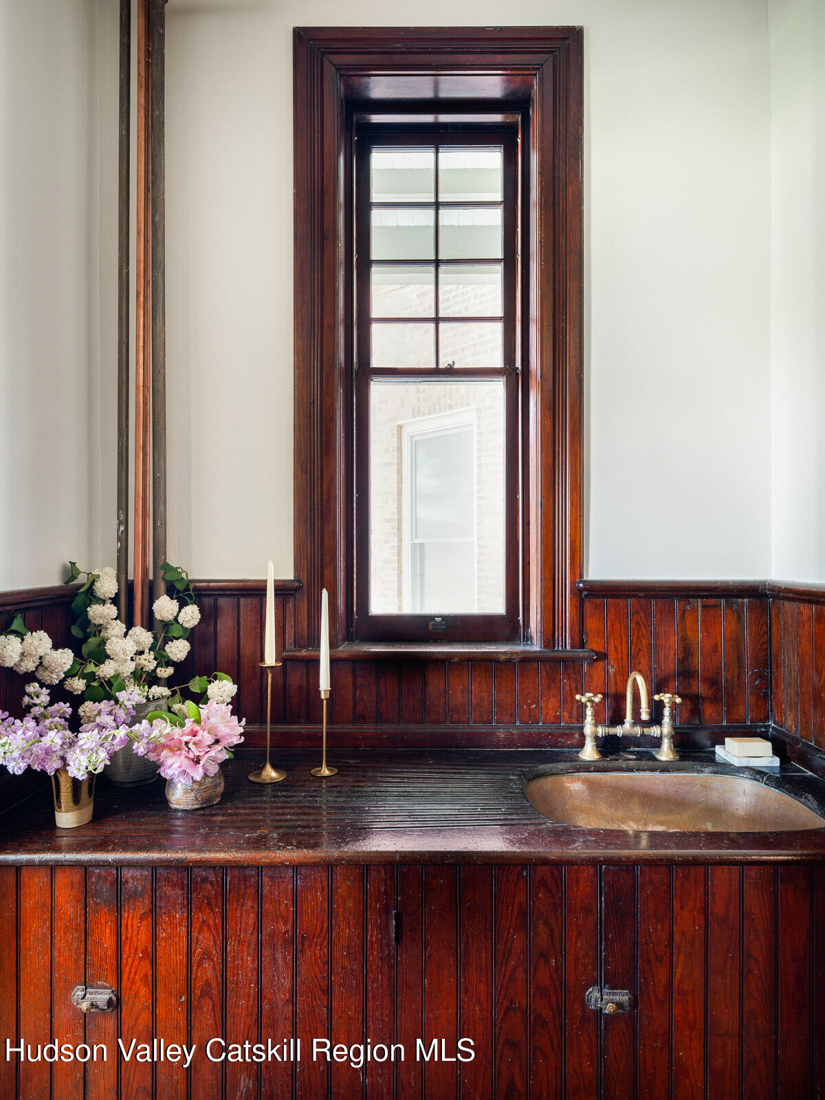 164 Grand Street Newburgh, NY 12550 - Photo 15 of 59 a bathroom with a sink mirror and cabinets