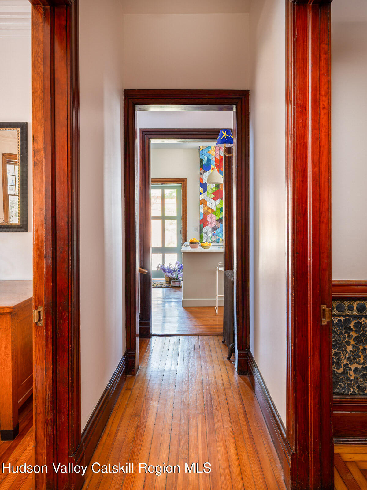 164 Grand Street Newburgh, NY 12550 - Photo 22 of 59 a view of a hallway view with wooden floor and living room