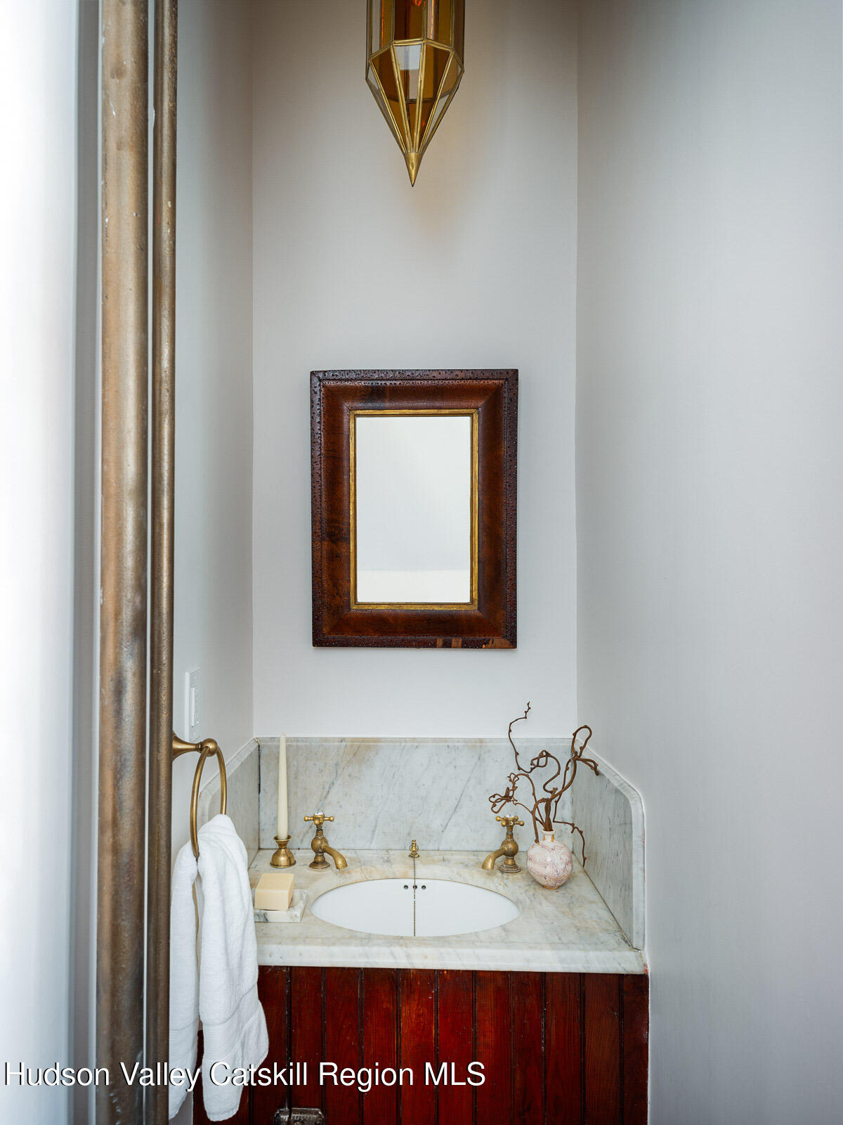 164 Grand Street Newburgh, NY 12550 - Photo 23 of 59 a bathroom with a sink and a mirror