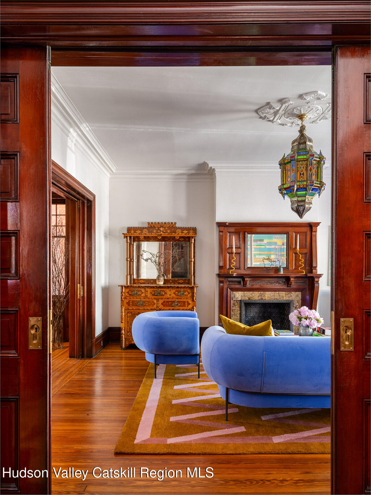 164 Grand Street Newburgh, NY 12550 - Photo 24 of 59 a living room with furniture and a fireplace