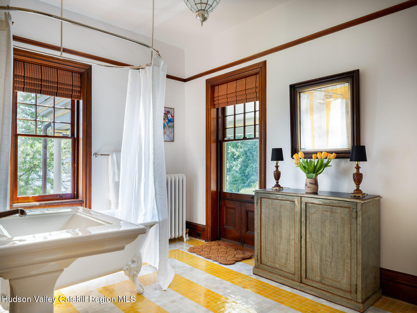 164 Grand Street Newburgh, NY 12550 - Photo 31 of 59 a living room with a window and a table