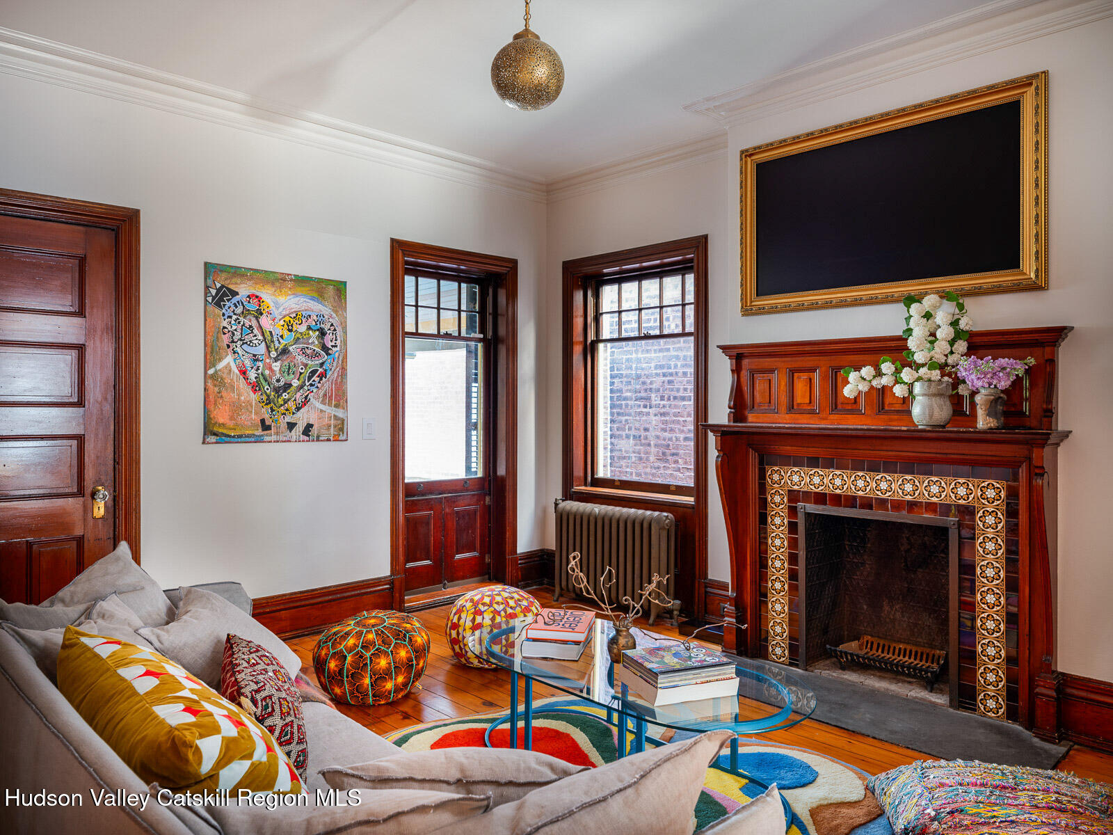 164 Grand Street Newburgh, NY 12550 - Photo 35 of 59 a living room with furniture fireplace and flat screen tv