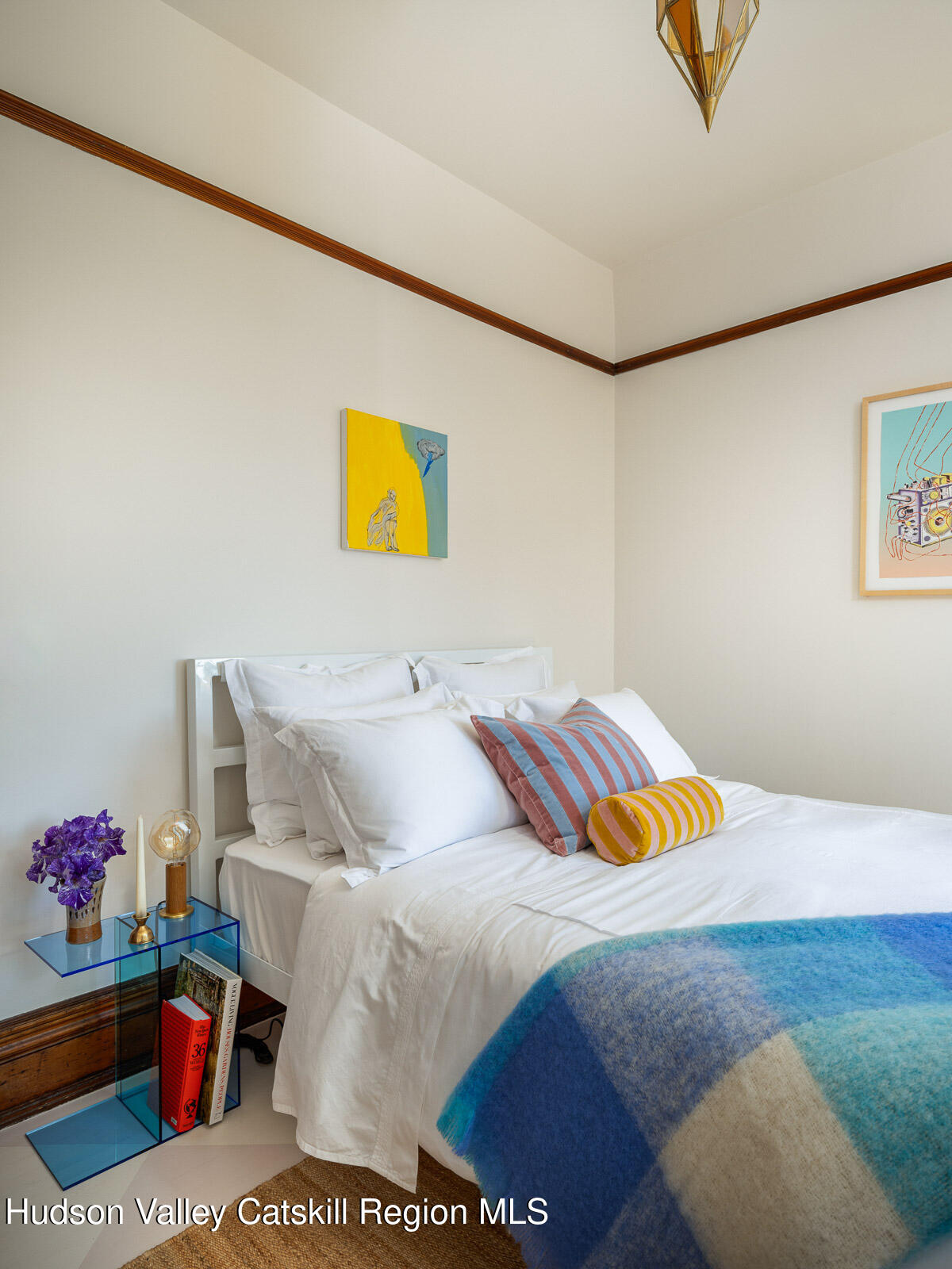 164 Grand Street Newburgh, NY 12550 - Photo 42 of 59 a bedroom with a bed and painting on the wall