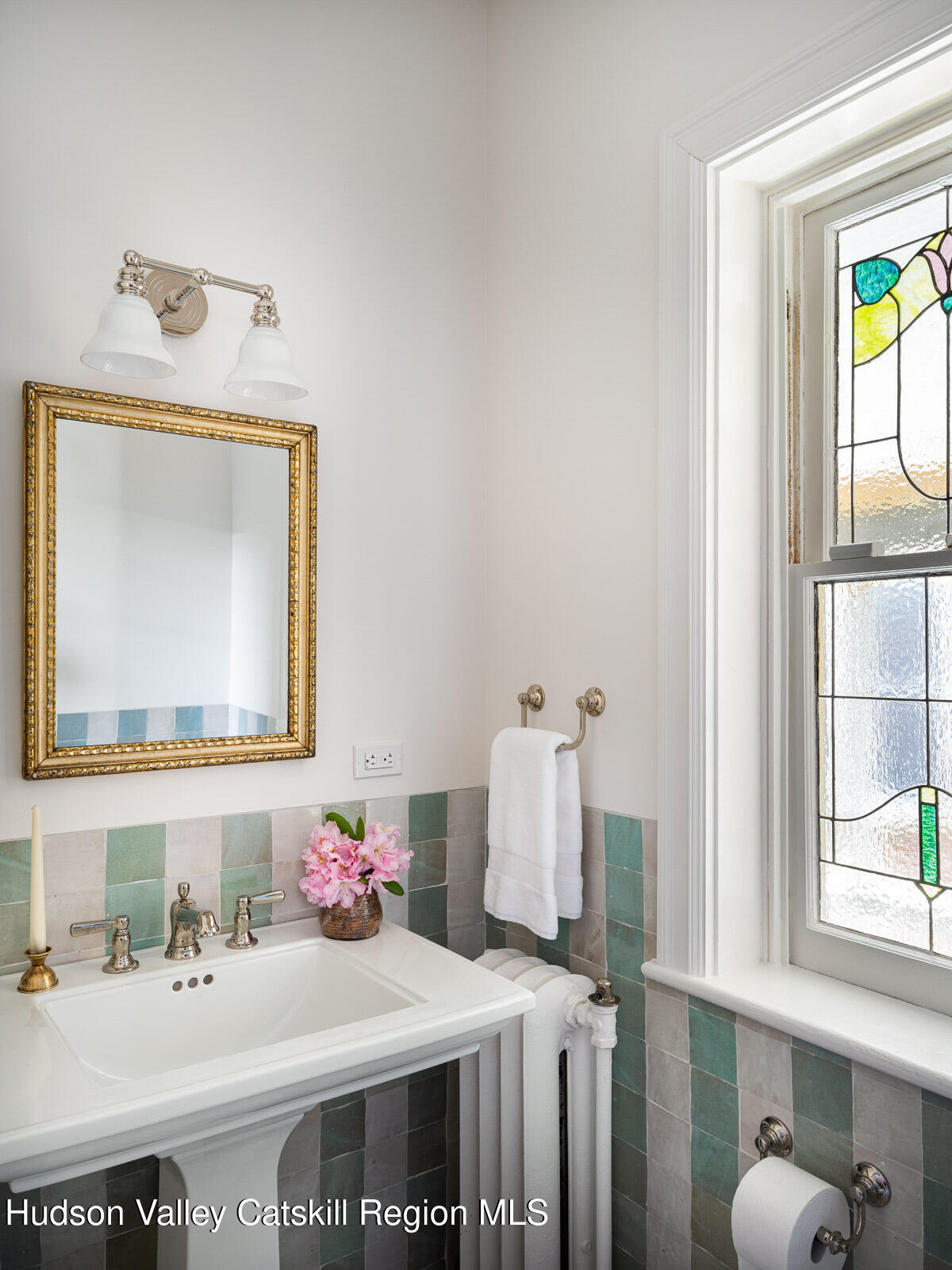 164 Grand Street Newburgh, NY 12550 - Photo 44 of 59 a bathroom with a sink and a mirror