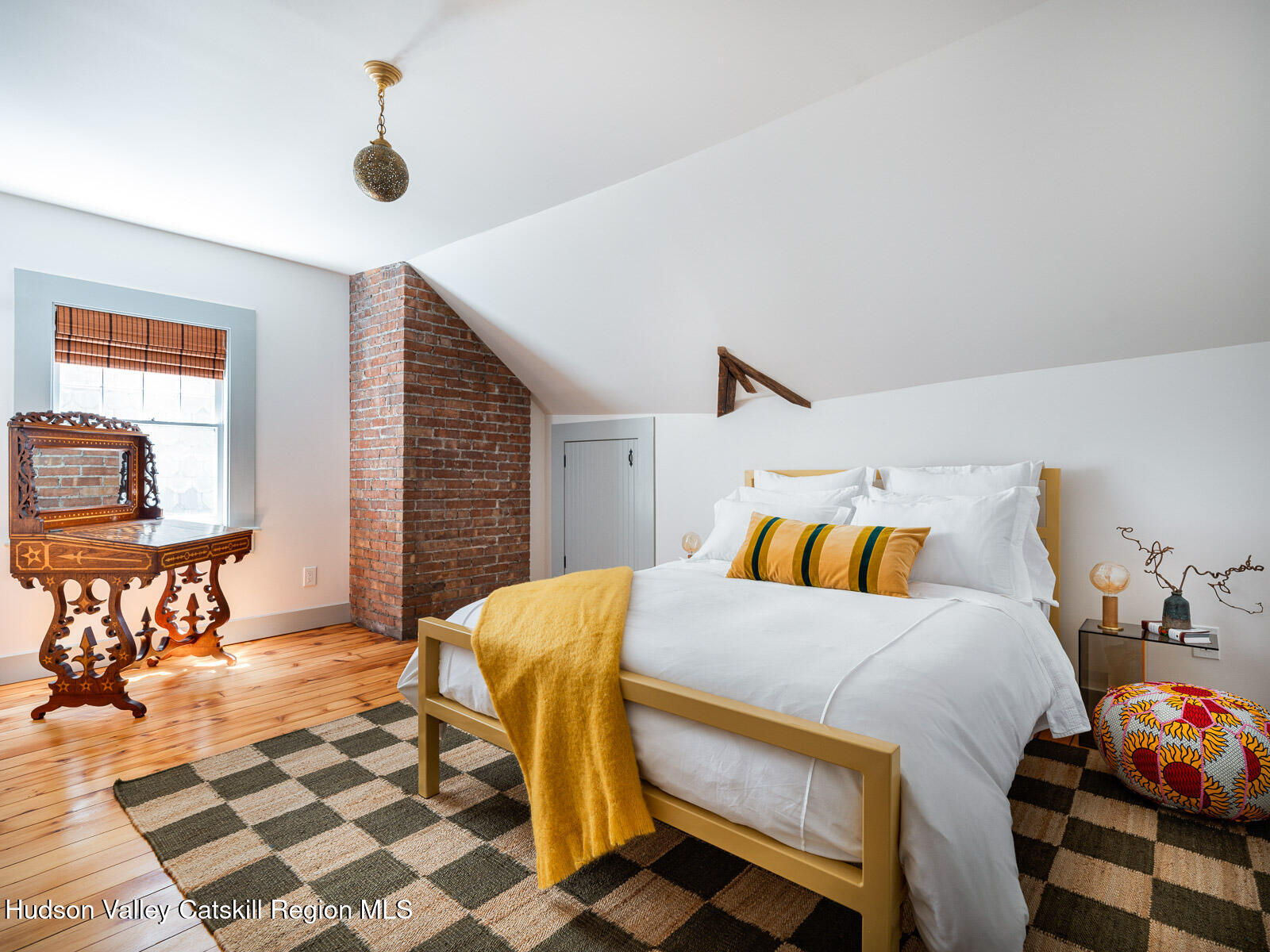 164 Grand Street Newburgh, NY 12550 - Photo 48 of 59 a bedroom with a bed and wooden floor