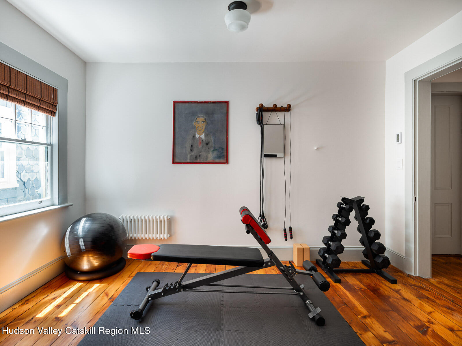 164 Grand Street Newburgh, NY 12550 - Photo 50 of 59 a room with gym equipment and a window