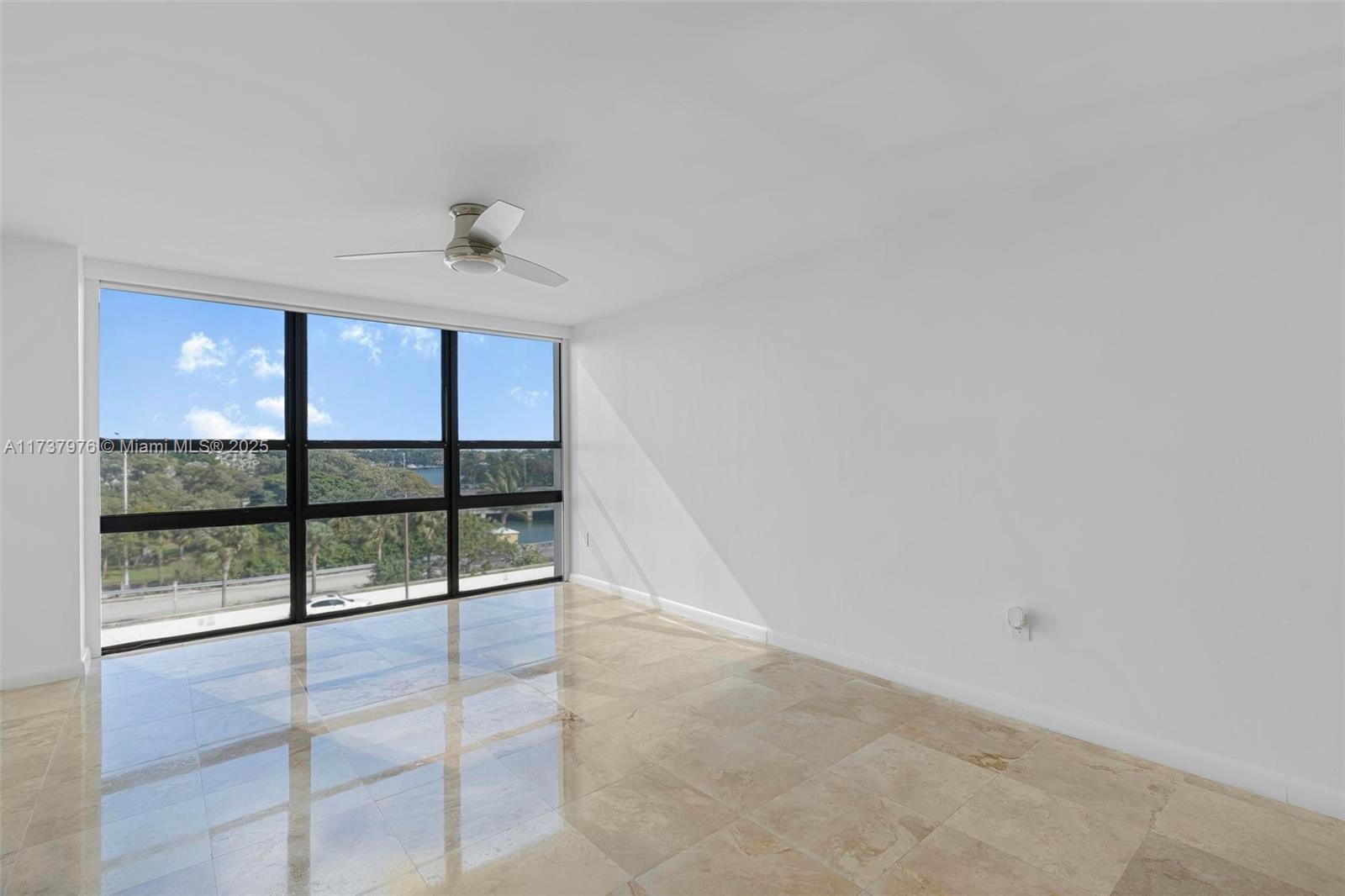 600 Northeast 36th Street, Unit 414 Miami, FL 33137 - Photo 14 of 51 wooden floor in an empty room with a window