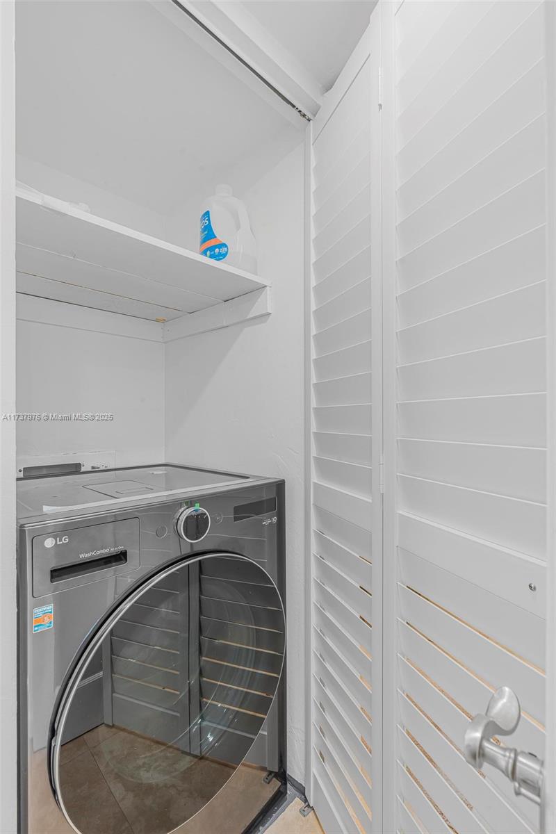 600 Northeast 36th Street, Unit 414 Miami, FL 33137 - Photo 21 of 51 a utility room with a washer and dryer