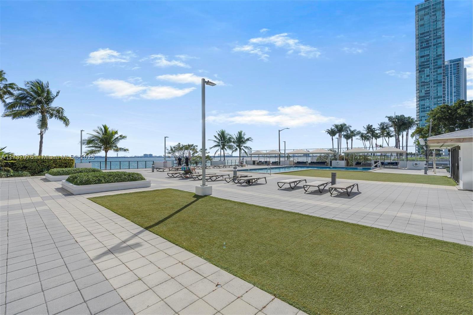 600 Northeast 36th Street, Unit 414 Miami, FL 33137 - Photo 33 of 51 a view of a swimming pool and lounge chairs