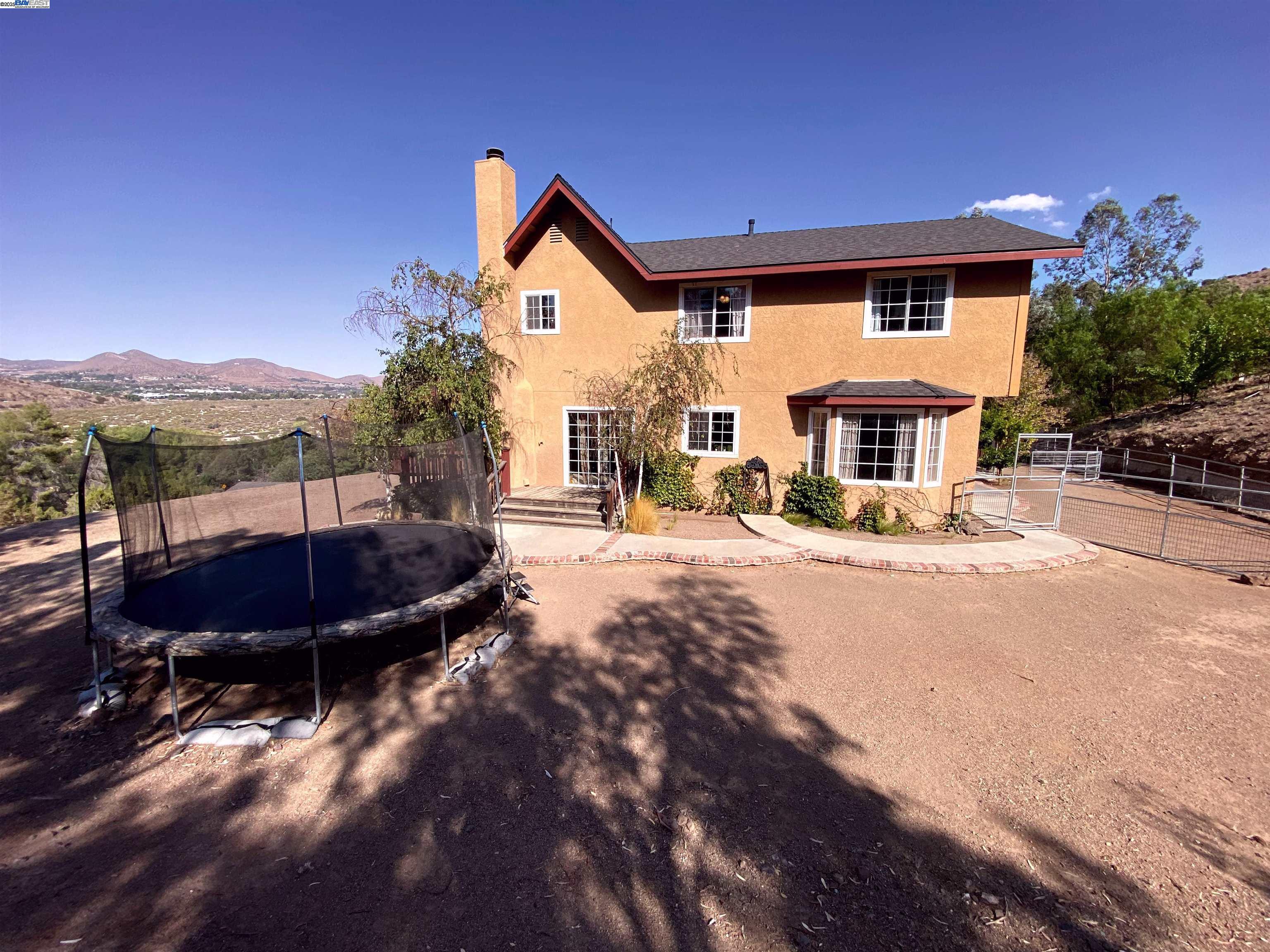 31733 Lake Meadow Road Acton, CA 93510 - Photo 11 of 24 a view of house with outdoor space and swimming pool