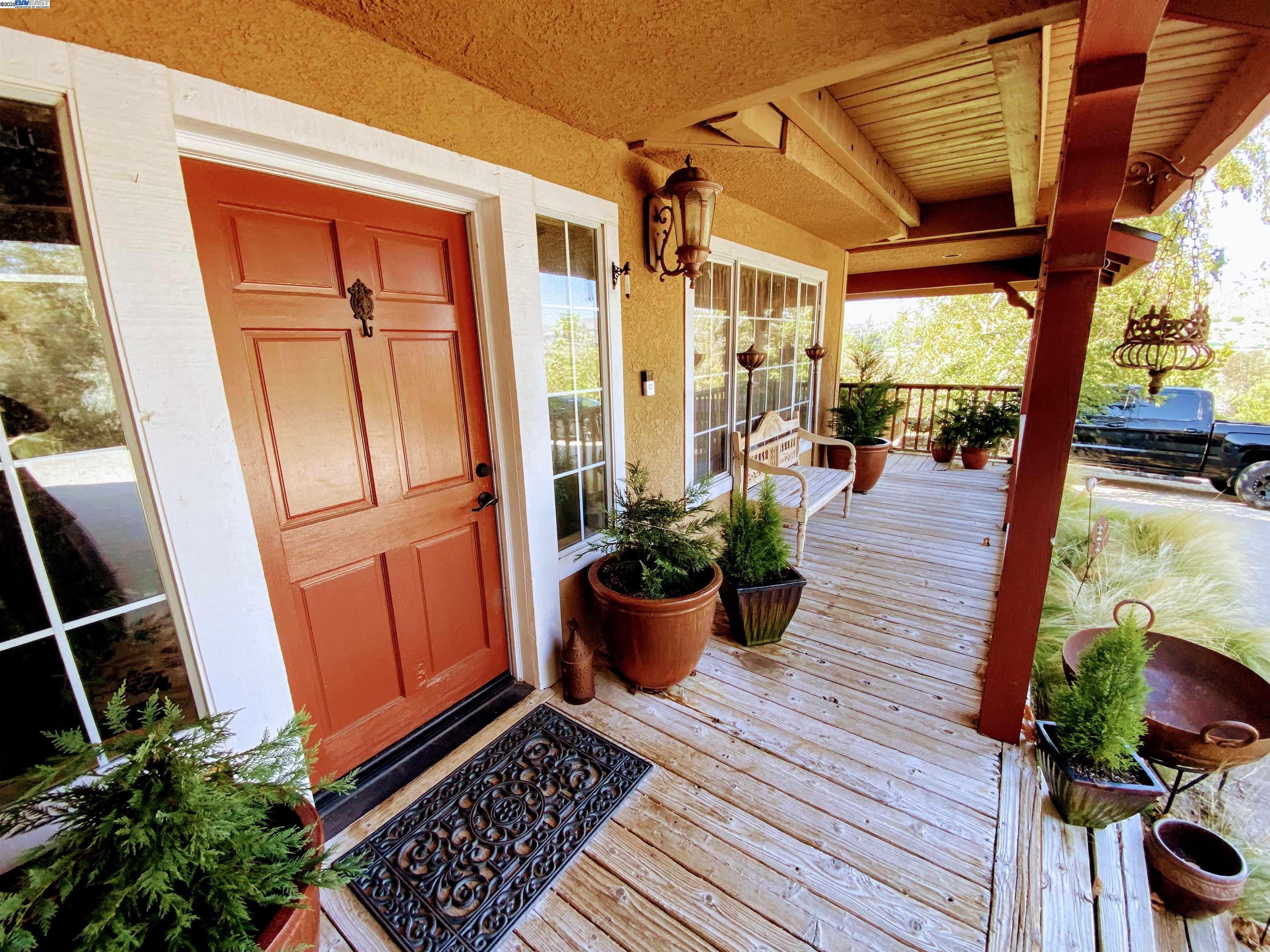 31733 Lake Meadow Road Acton, CA 93510 - Photo 12 of 24 a view of a porch with chairs and potted plants