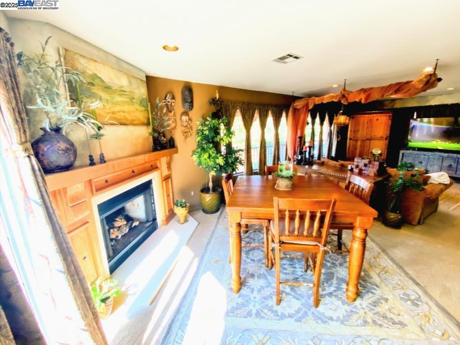 31733 Lake Meadow Road Acton, CA 93510 - Photo 23 of 24 a living room with furniture a fireplace and a flat screen tv