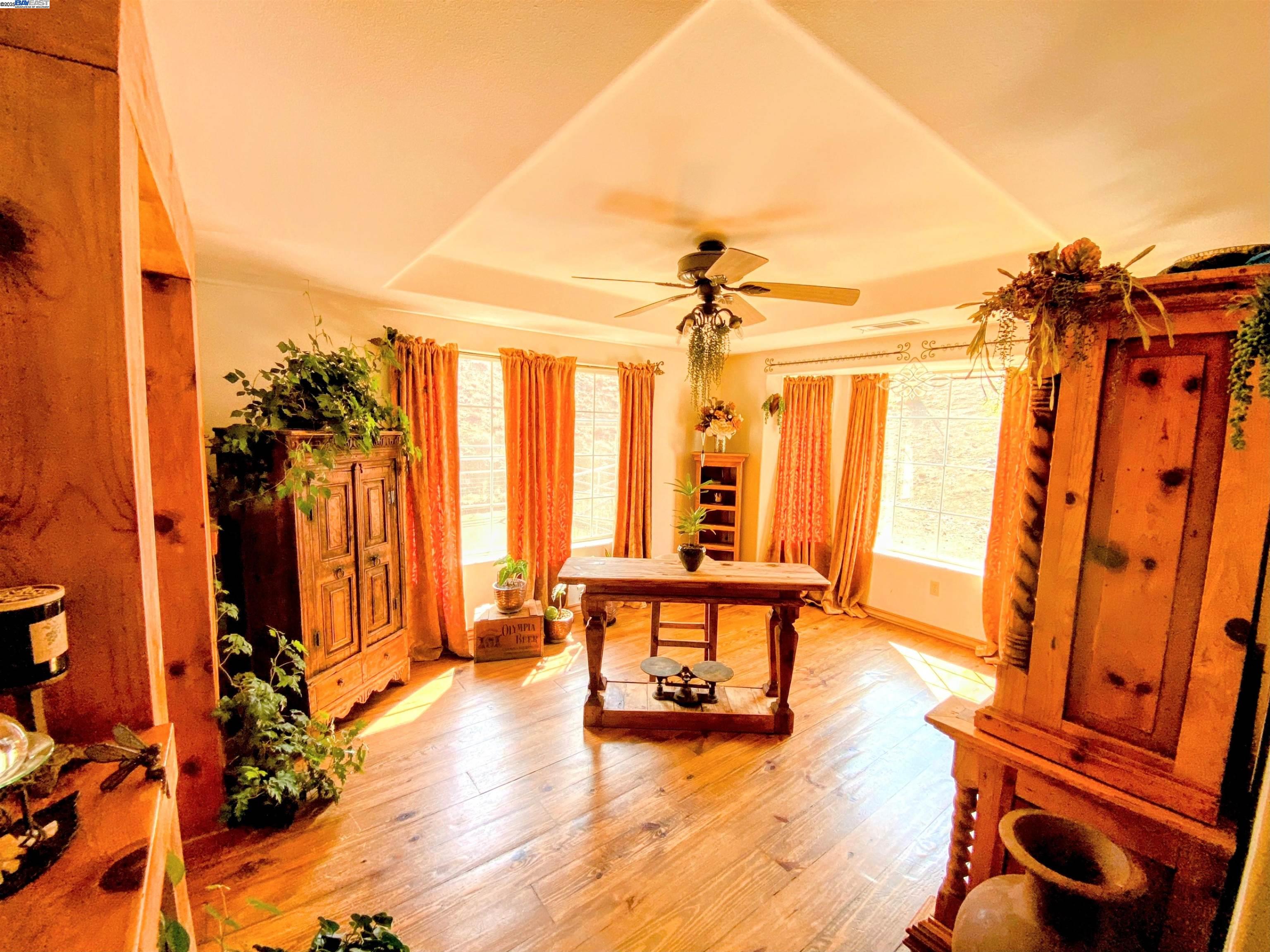 31733 Lake Meadow Road Acton, CA 93510 - Photo 24 of 24 a view of a living room with furniture and wooden floor