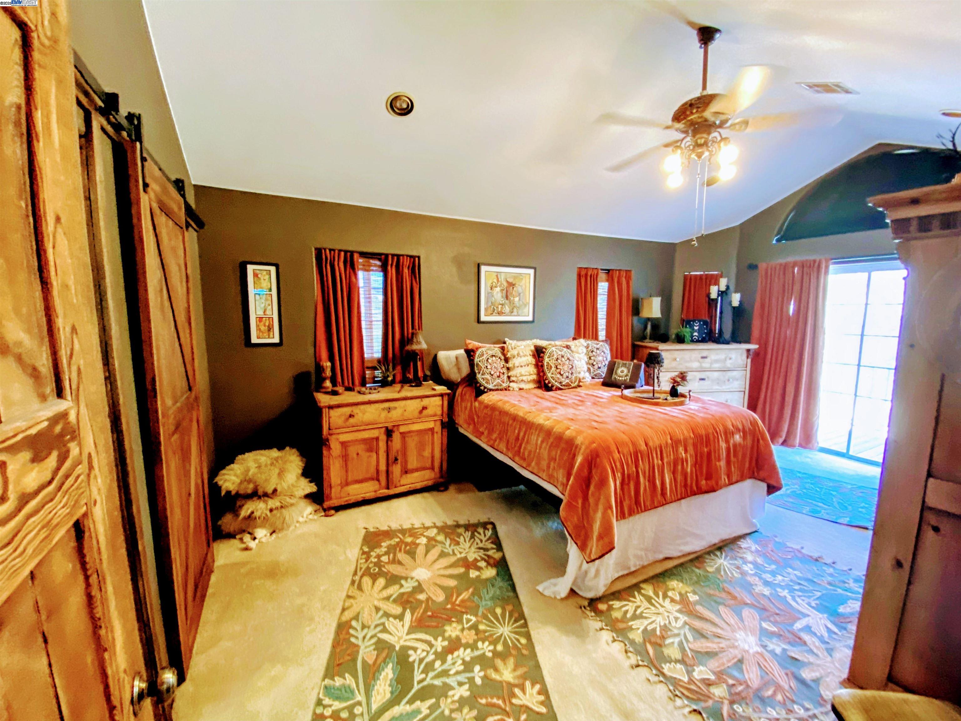 31733 Lake Meadow Road Acton, CA 93510 - Photo 6 of 24 a bed room with a bed and a chandelier