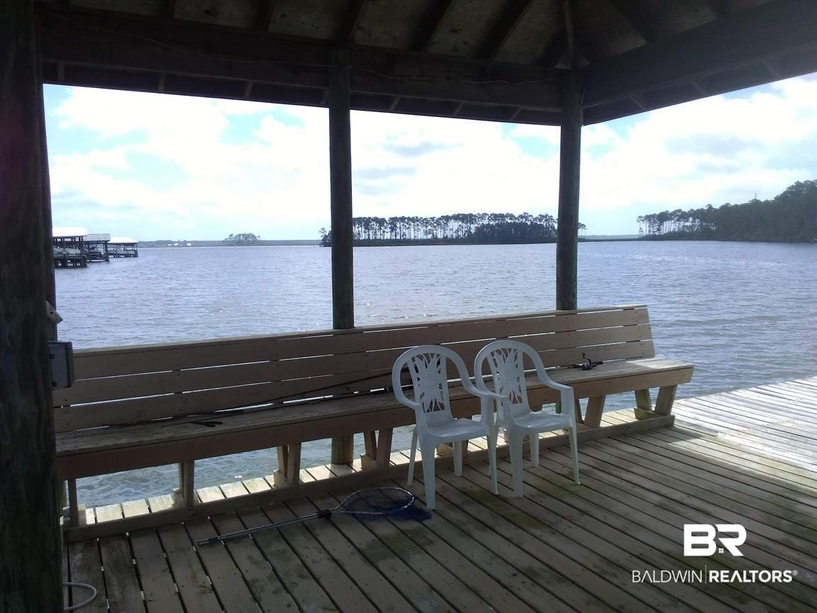8132 Bay View Drive Foley, AL 36535 - Photo 44 of 50 Bench and bay view left