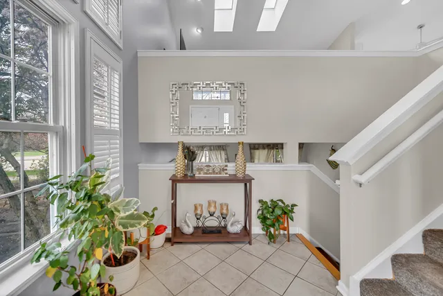 a view of living room filled with furniture and a potted plant