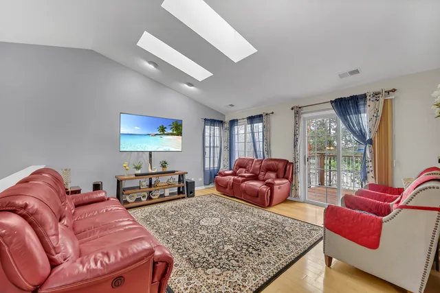 a bedroom with a large bed and a couch