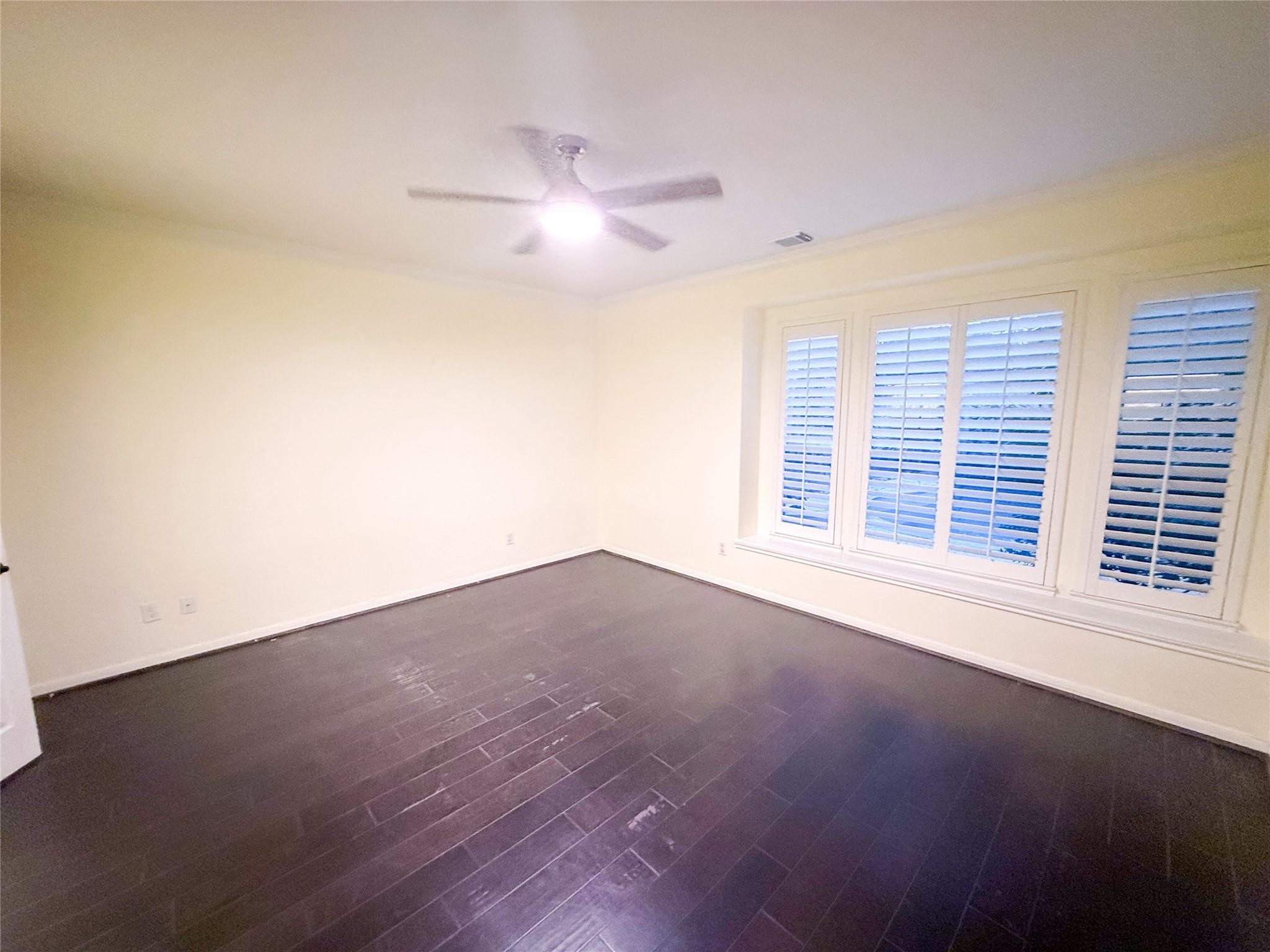 79 West Shale Creek Circle Spring, TX 77382 - Photo 19 of 29 an empty room with wooden floor and windows