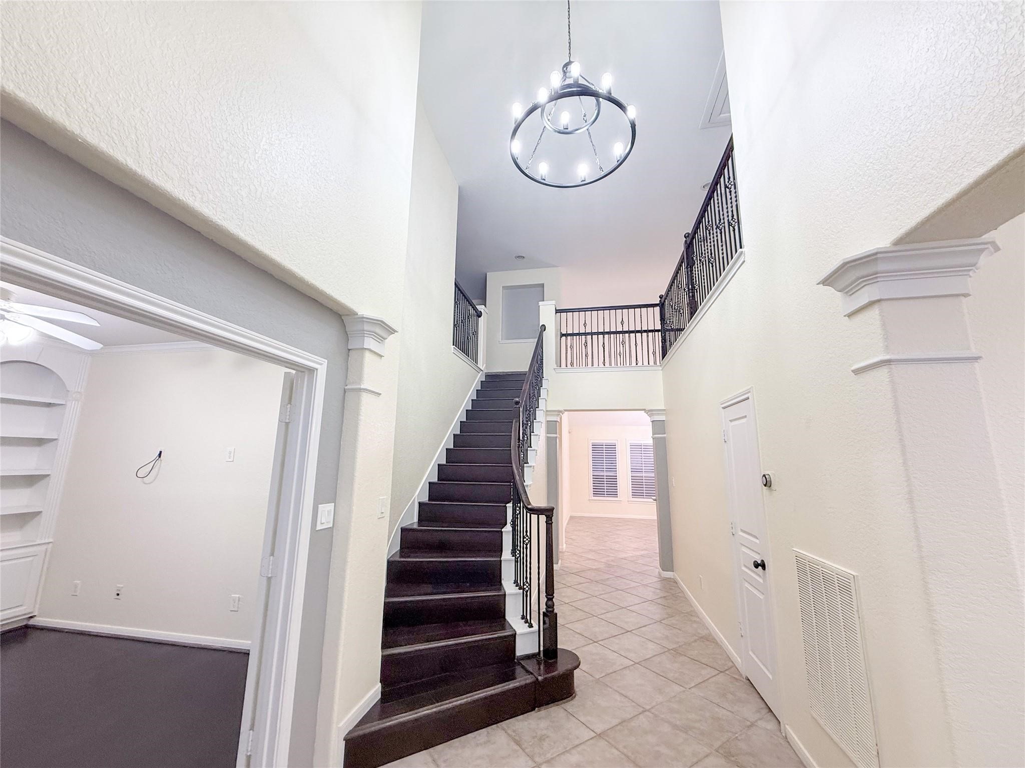 79 West Shale Creek Circle Spring, TX 77382 - Photo 10 of 29 a view of a hallway with wooden floor and staircase