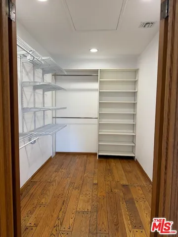 a view of an empty walk in closet