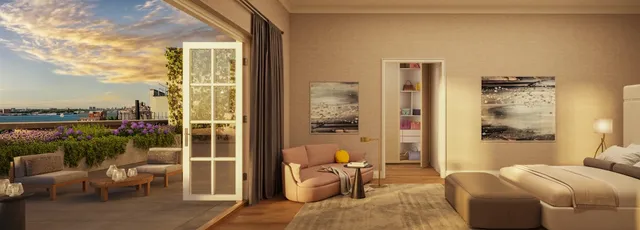 a living room with furniture potted plant and a large window