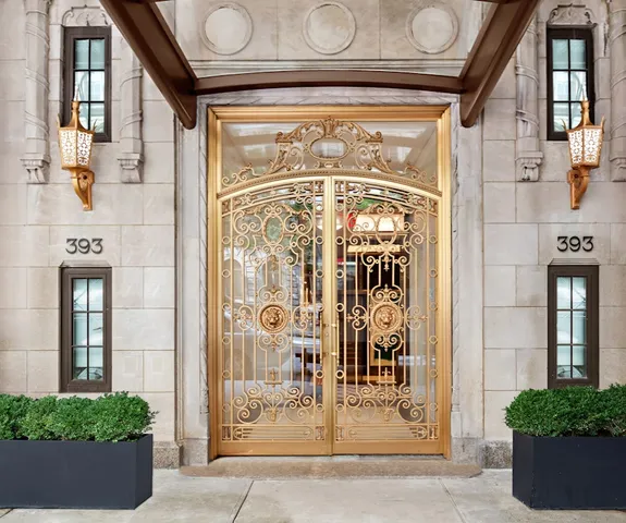 a bedroom with furniture and a floor to ceiling window