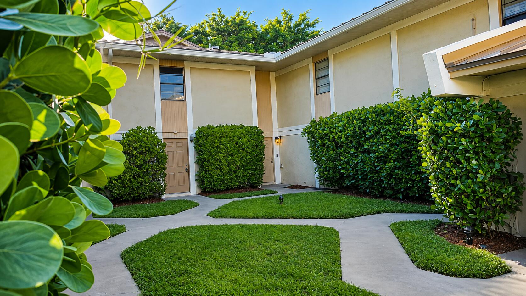 8801 West Sample Road, Unit 4 Coral Springs, FL 33065 - Photo 16 of 19 Sunny Landscaped Townhouse Courtyard