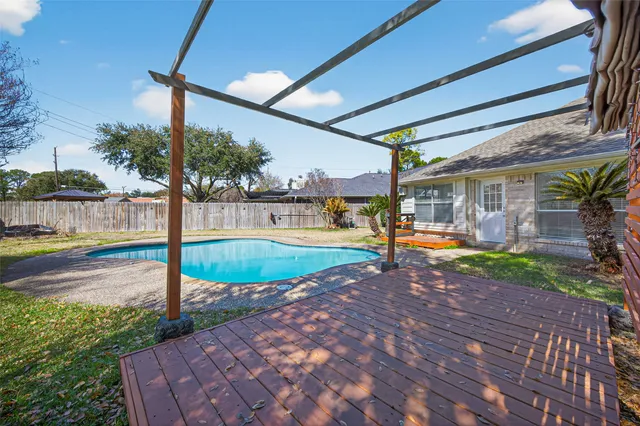 a view of a swimming pool with a patio